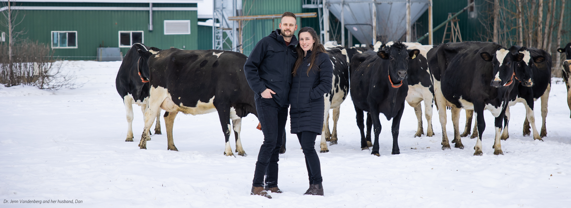 Dr. Jenn Vandenberg and her husband, Dan in front of their dairy farm.