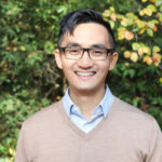 Dr. Joseph Leung standing outside, smiling